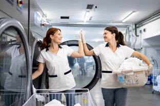 Laundromat Workers Shutterstock 2568537815